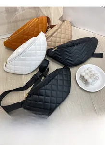 Close-up of quilted PU leather waist bags with gold zippers in various colors and patterns