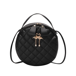 Elegant black quilted leather round handbag with golden flamingo detail and top handle