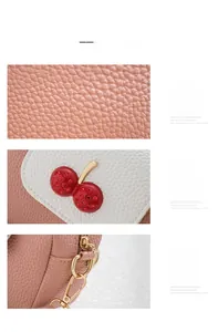 Detail of pink lychee leather texture and cherry ornament with gold hardware