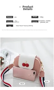 Pink cherry crossbody bag with litchi grain texture and wide tricolor textile strap