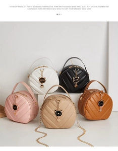 Group view of round quilted crossbody bags with cat charms in five elegant colors