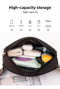 Compartiment spacieux du sac banane de sport noir contenant téléphone et accessoires