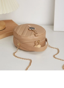 Detail of V-quilted beige mini square bag with gold hardware and cat charm