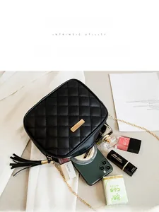 Top view of black quilted crossbody bag showing interior space with daily essentials