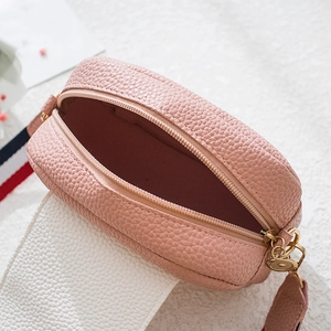 Pink round leather camera bag with litchi grain and tricolor woven shoulder strap