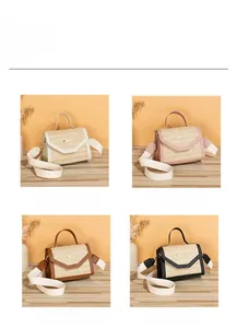Close-up of straw crossbody bag showing texture in white, pink, brown, and black