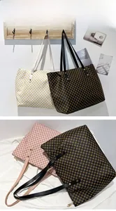 Detailed view of large polka dot tote bags in black, white and pink with top zippers
