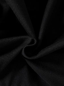 Close-up of black mesh fabric showing fine woven texture and soft drape on dress