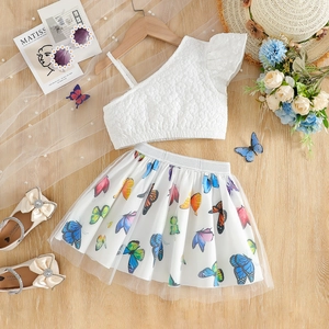 Detail of girl's summer outfit showing 3D bubble texture top and butterfly print tulle skirt