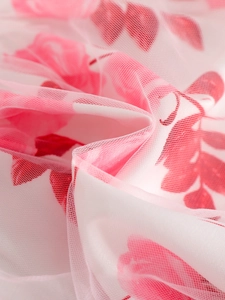 Girl's white tulle skirt with soft pink floral print and lightweight layered mesh fabric