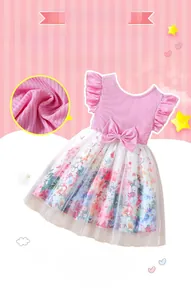 Detail of pink knitted top with flutter sleeves and colorful mesh floral skirt