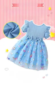 Detail view of sky blue girls' dress with butterfly sequins and mesh tutu skirt fabric