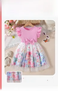 Close-up of summer girl dress with pink flutter sleeves and floral mesh skirt