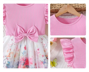 Detail of pink ruffled sleeves and a large waist bow on the floral mesh princess dress