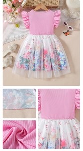 Close-up of pink knit bodice with ruffle sleeves and floral mesh layered skirt detail