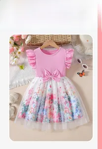 Detail of baby girl floral tulle dress with small flutter sleeves and waist bow