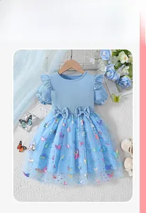 Close-up of blue girl's dress with butterfly mesh skirt and sweet bow decorations