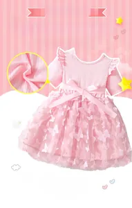 Detail of pink summer dress featuring 3D butterfly embroidery and soft mesh fabric layers