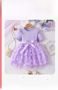 Detail of purple girl dress with 3D mesh flowers and satin bow on ribbed cotton bodice