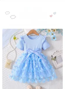 Close-up of sky blue girl dress featuring 3D butterfly appliques and layered tulle skirt