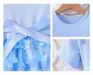 Detail view of girl's blue princess dress featuring 3D floral lace and a large satin bow