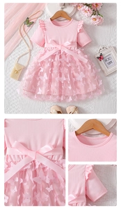 Detail of girls pink princess dress with 3D floral appliques and satin waist bow