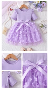 Detail of lavender tulle dress featuring 3D butterflies and a satin waist bow