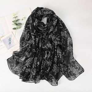 Elegant black paisley voile scarf with white floral patterns and soft cotton texture
