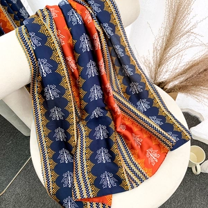 Retro ethnic print silk shawl with tribal patterns in navy blue and vermilion red