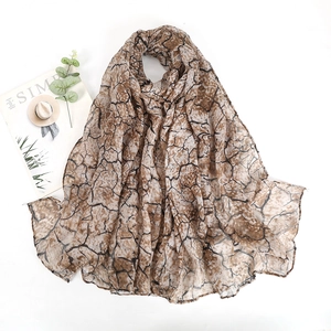 Lightweight bali yarn scarf with crackle print pattern in coffee brown and black tones