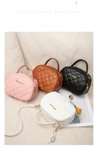 Detailed view of quilted faux leather handbags in pink, brown, black, and white colors