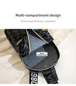Detail view of the multi-compartment interior with gold zippers and printed branding