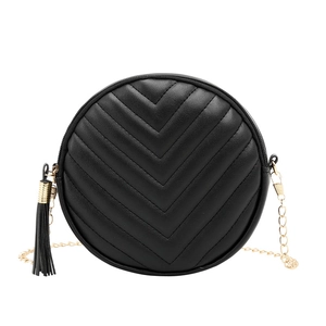 Fashionable black circular crossbody bag with chevron quilting and gold chain strap