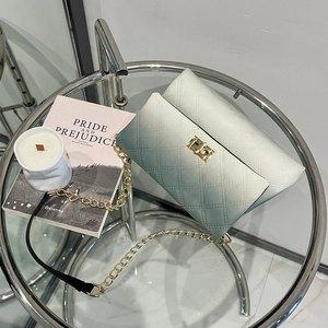Quilted gradient mint green and white crossbody bag with gold chain and metal lock
