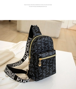 Detail of black crossbody bag with white letter print and gold hardware plating
