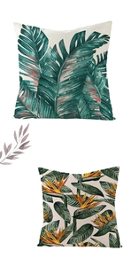 Close-up of tropical green leaves and bird of paradise flower on woven pillow covers