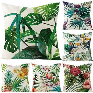 Macro detail of tropical leaf prints on textured polyester cushion covers for sofa