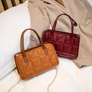 Minimalist embroidered quilted crossbody handbags in brown and burgundy faux leather