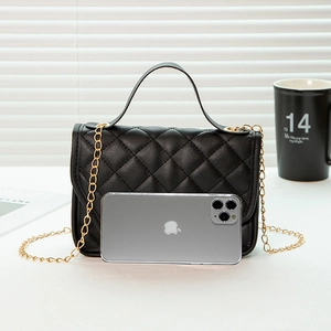 Chic black quilted crossbody bag with gold chain and mobile phone for size reference