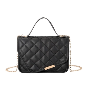 Black quilted crossbody bag with golden chain strap and minimalist metal clasp
