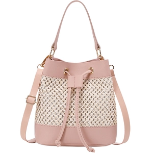 Pink and beige woven drawstring bucket bag with adjustable shoulder strap and gold hardware
