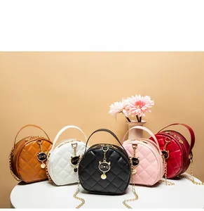 Quilted round mini bags in five colors with cat charms and gold chain straps