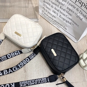 Chic quilted crossbody camera bags with contrast logo straps in black and white
