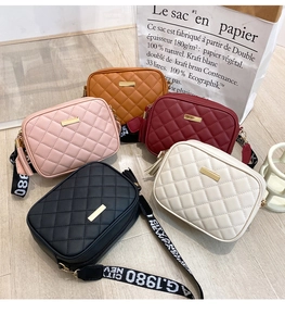 Multi-color quilted crossbody camera bags with tassels and wide patterned shoulder straps