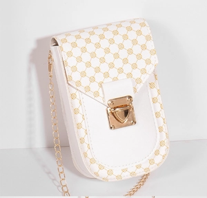 Detail view of white mini crossbody bag with yellow flower patterns and gold chain strap