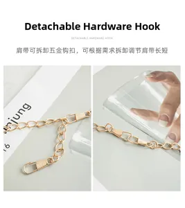 Detail of detachable golden hardware hook and adjustable chain link for shoulder bags
