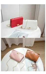 Selection of crocodile pattern small flap bags with gold chain straps in four vibrant colors