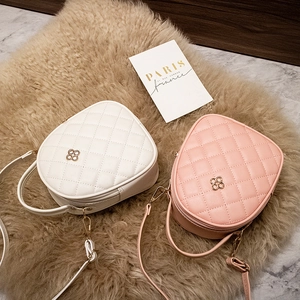 Quilted mini crossbody bags in white and pink leather with gold clover hardware