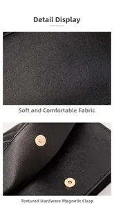 Detail shot of black lychee grain leather texture and gold magnetic metal buckle