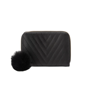 Women's black V-quilted small wallet with plush pompom charm and gold zip closure